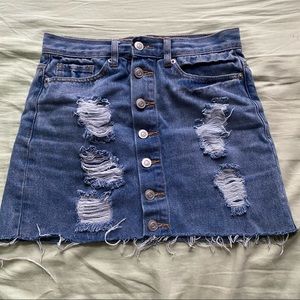 Distressed denim mini skirt